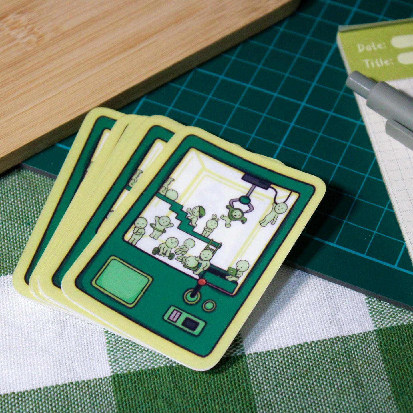 Green Little Guys Trapped in a Claw Machine Translucent Vinyl Sticker